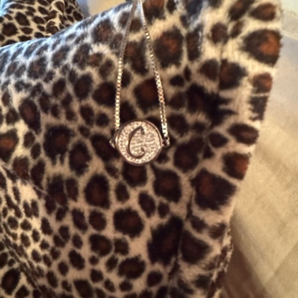"C" bracelet with silver chain, and clear stones